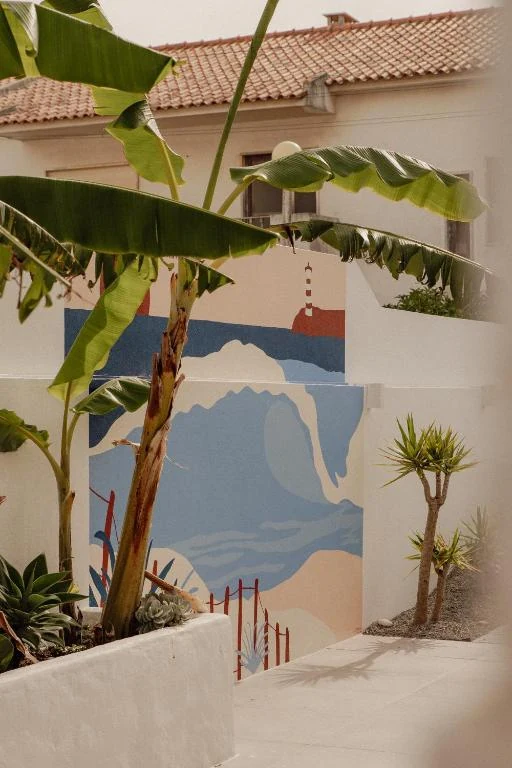 Coastal mural and tropical plants in the house courtyard