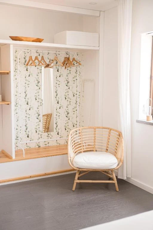 Natural rattan chair in a bright guest room